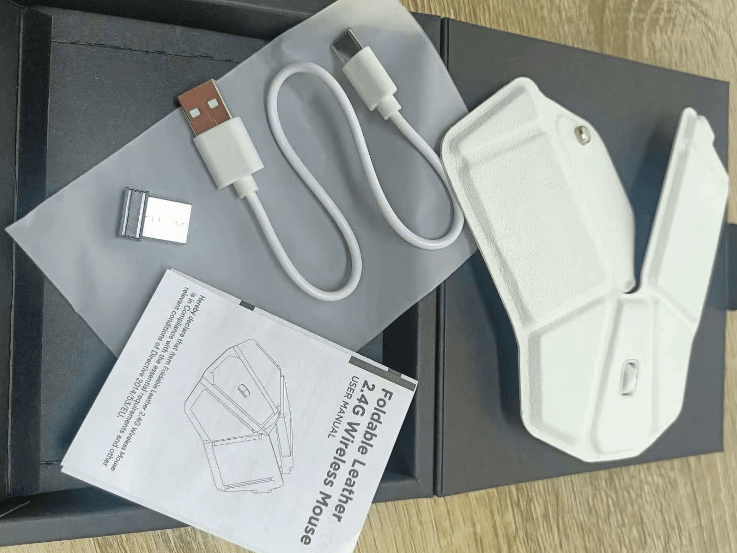 Origami Wireless Travel Mouse with ultra-slim folding design and ergonomic portability.