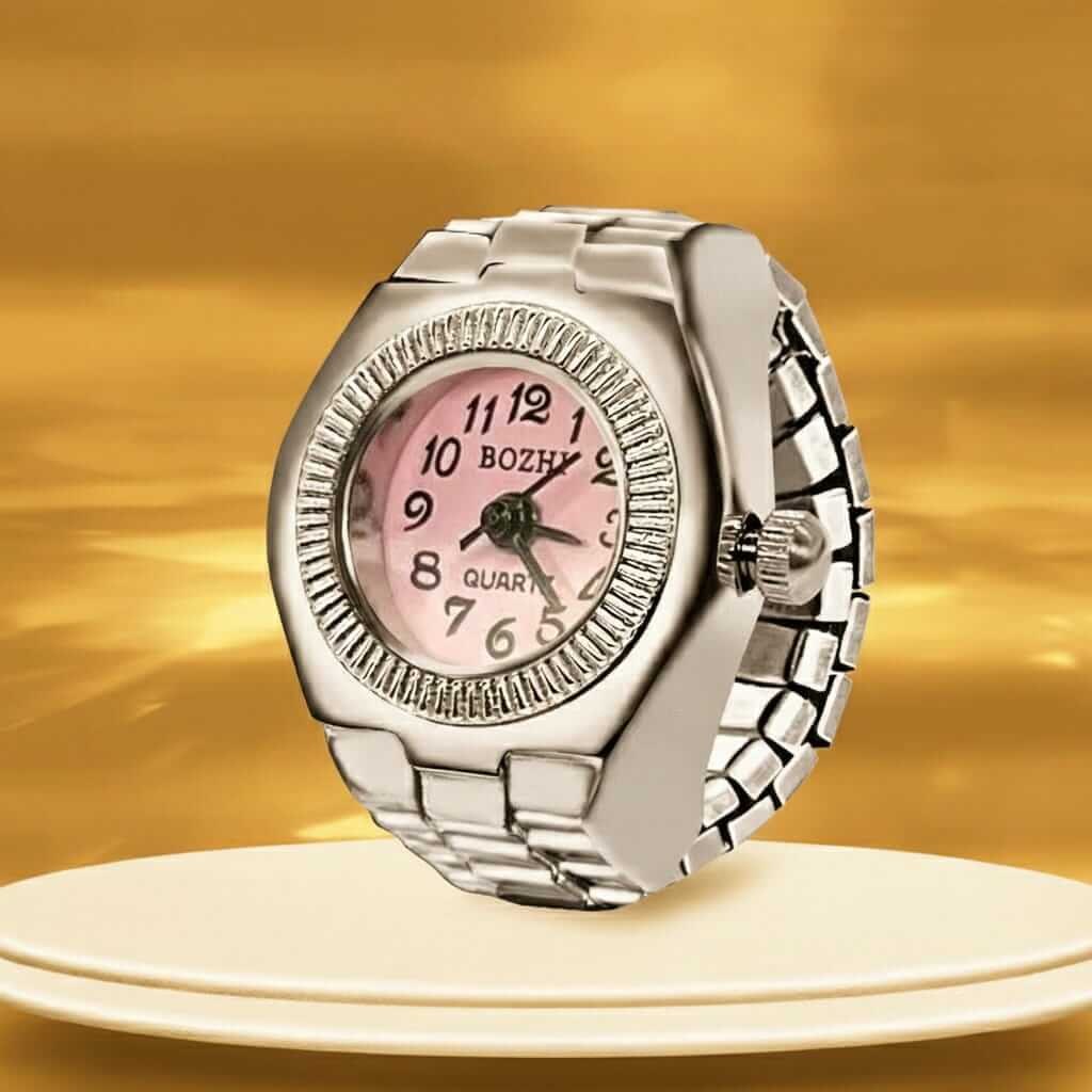 Glimmer Time Ring featuring a stylish quartz watch with pink face and elegant bezel on a flexible bracelet-style band.