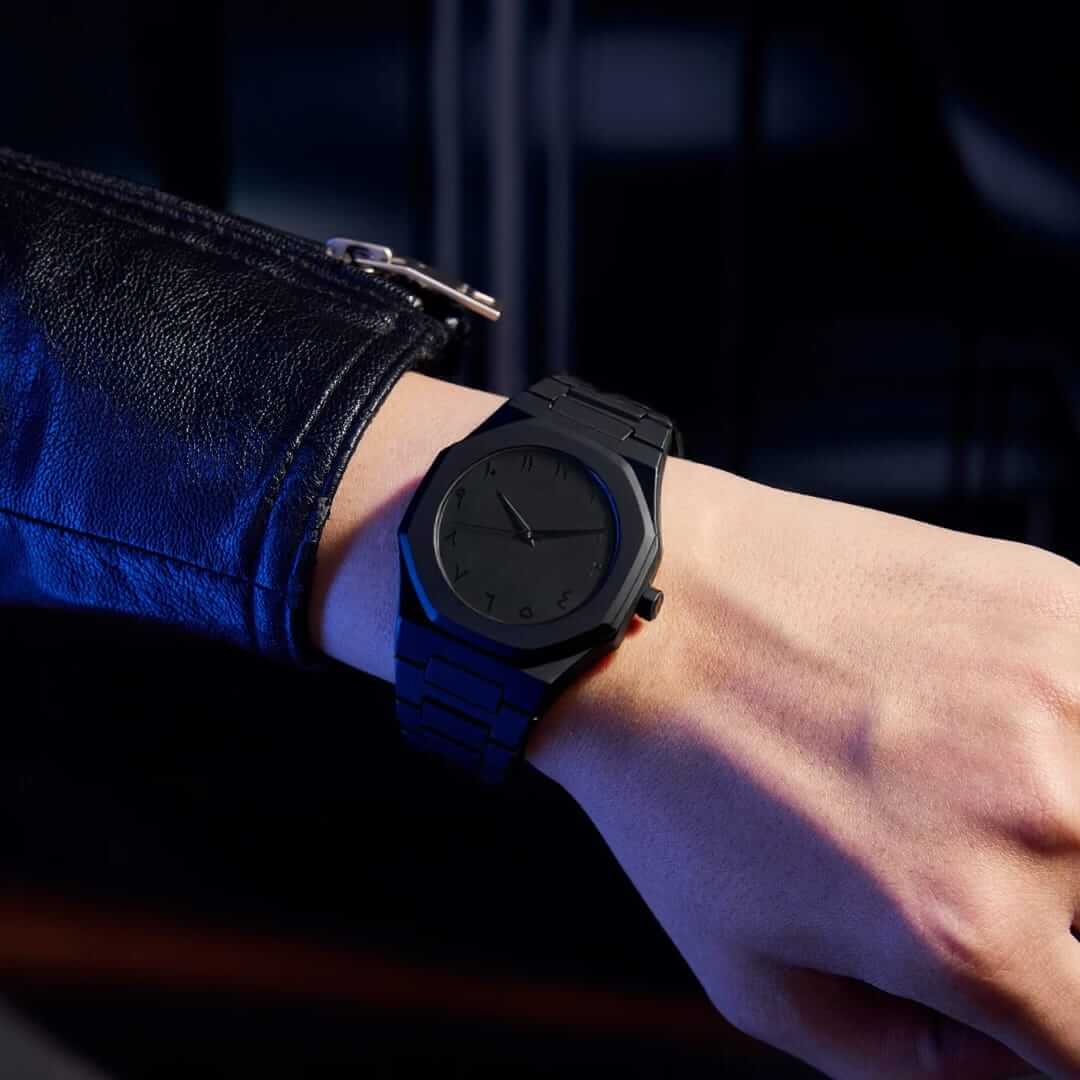 Stealth Arabic Dial Watch on a person's wrist showcasing a modern design with a monochromatic black finish.