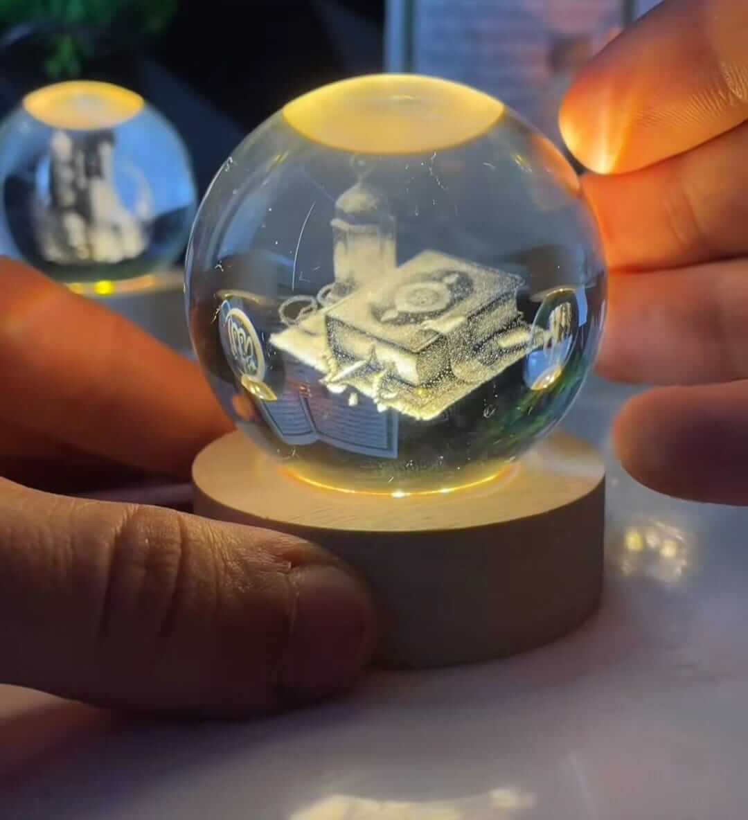 Noor Crystal 3D glowing crystal sphere with intricate 3D design, illuminating a serene atmosphere.