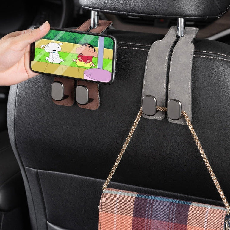 Double Hook Car Seat Hanger holding a phone and handbag on a car seat for organized storage and convenience.