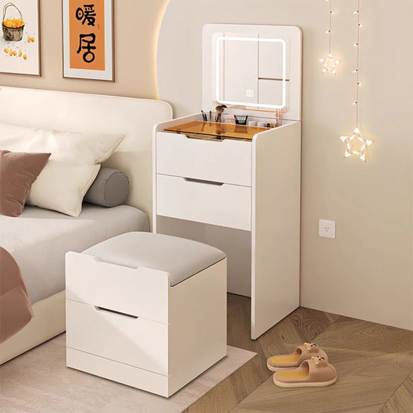 Compact white Compact Dressing Unit with an open flip-top LED mirror, visible glass drawer, and a cushioned storage stool.