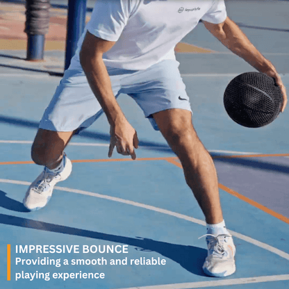 Man dribbling a 3D printed airless basketball on a court, showcasing impressive bounce and performance.