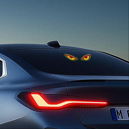 Car Window Evil Eyes Neon Light displayed on a vehicle's rear window, showcasing its vibrant red and yellow design.