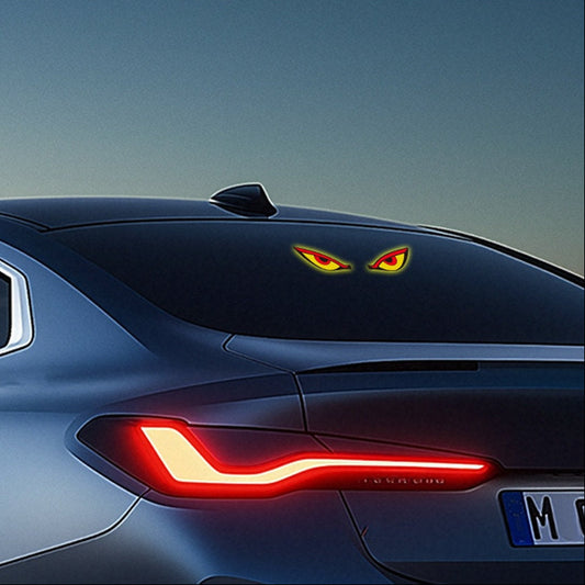 Car Window Evil Eyes Neon Light displayed on a vehicle's rear window, showcasing its vibrant red and yellow design.