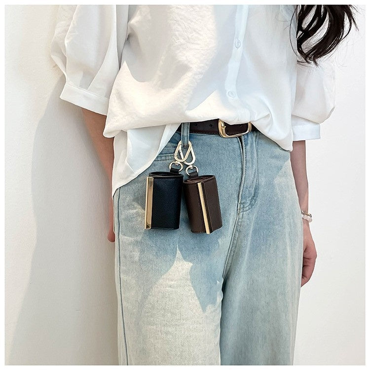 Foldable Lightweight Shoulder Bag key ring capsule tote hanging from a belt loop, showcasing a stylish and practical accessory.