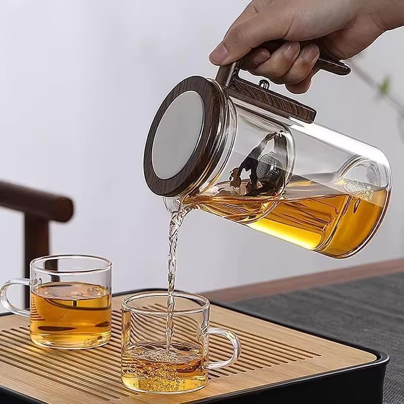 One-Click Magnetic Teapot featuring tea-water separation, a glass body, and a natural wood handle. Premium Lifestyle Gear.