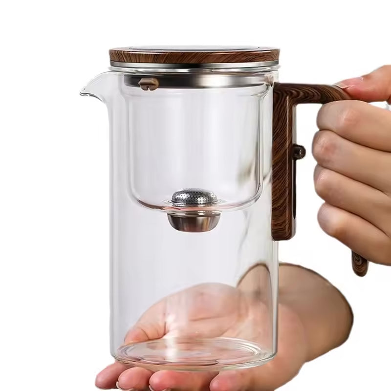One-Click Magnetic Teapot featuring tea-water separation, a glass body, and a natural wood handle. Premium Lifestyle Gear.