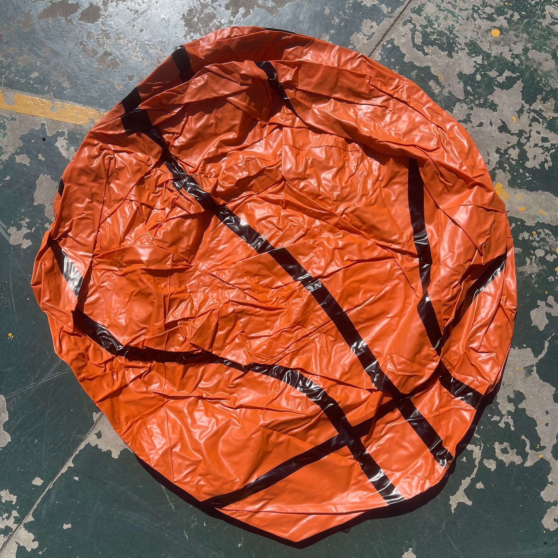 an Inflatable Basketball Sofa, in court side