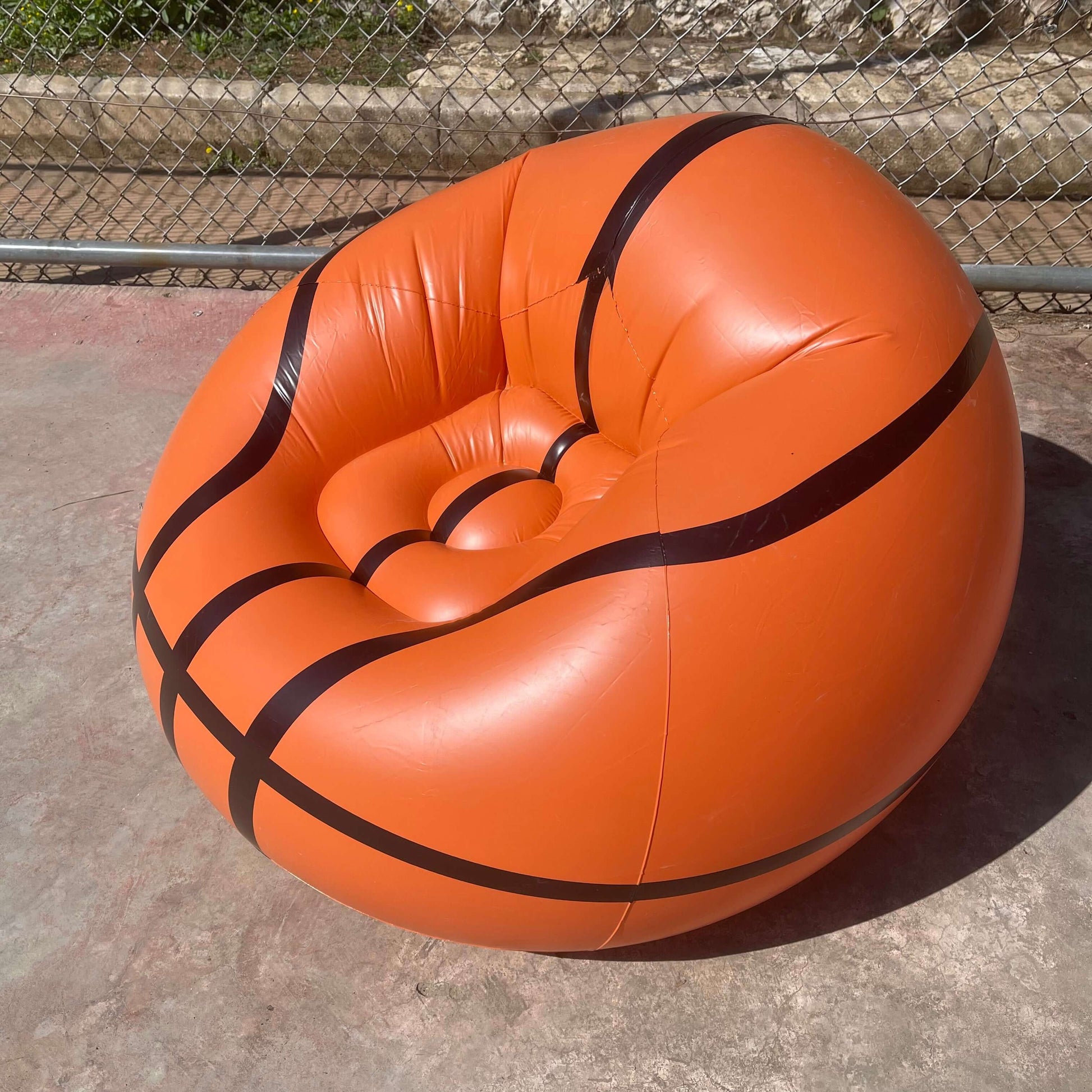 an Inflatable Basketball Sofa, in court side