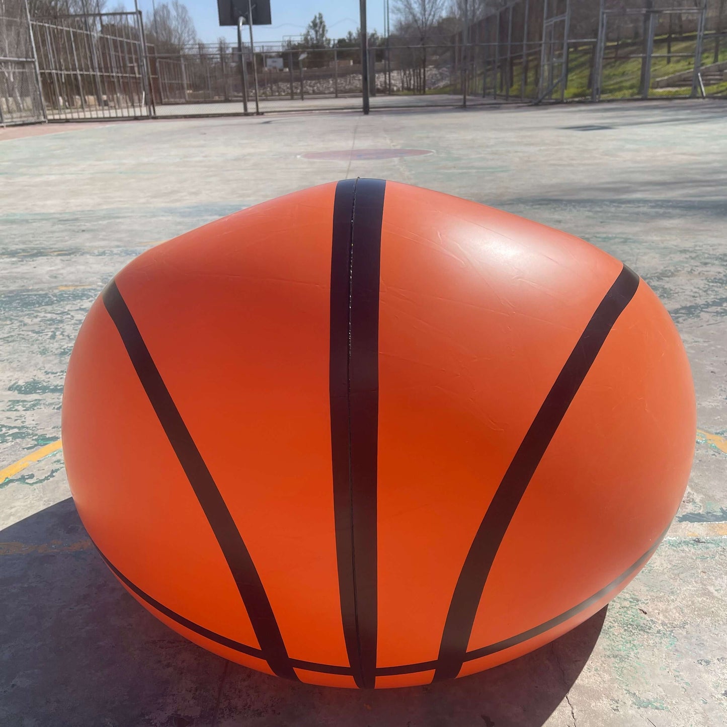 an Inflatable Basketball Sofa, in court side