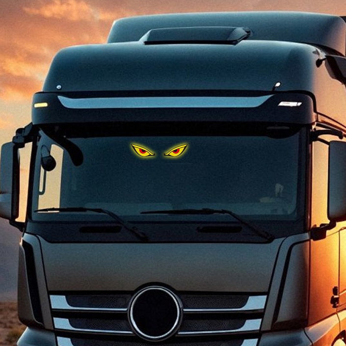 Car Window Evil Eyes Neon Light displayed on truck windshield, featuring yellow and red glowing eyes.