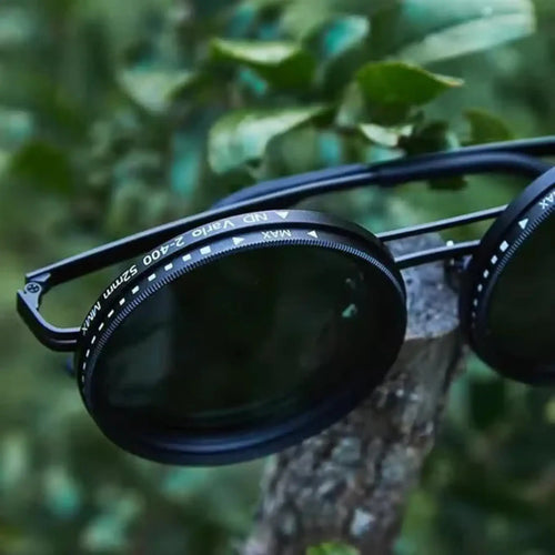 Adjustable Tint Sunglasses: SmartShade HD on a tree branch showcasing ND filter lenses.
