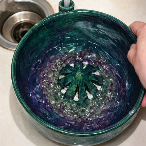 Berry Vortex Washing Bowl with water, featuring a unique strainer design for effective fruit cleaning.