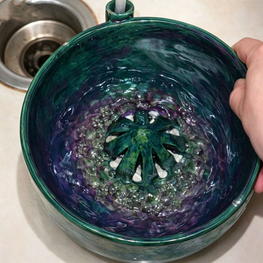 Berry Vortex Washing Bowl with water, featuring a unique strainer design for effective fruit cleaning.