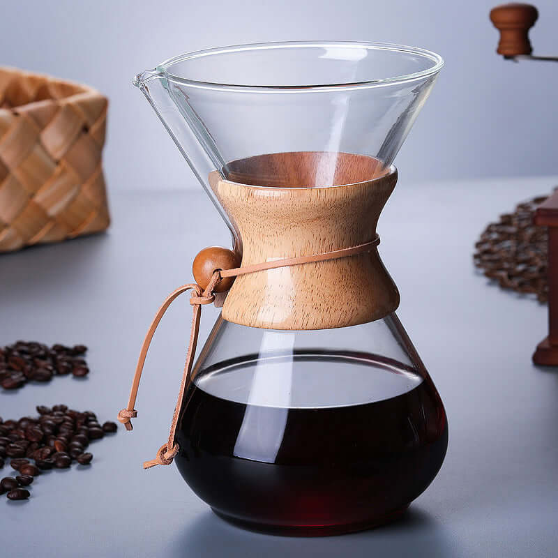 Chemex Coffee Maker – Premium 400ml Glass Pour Over Brewer with wooden collar and rich coffee inside.