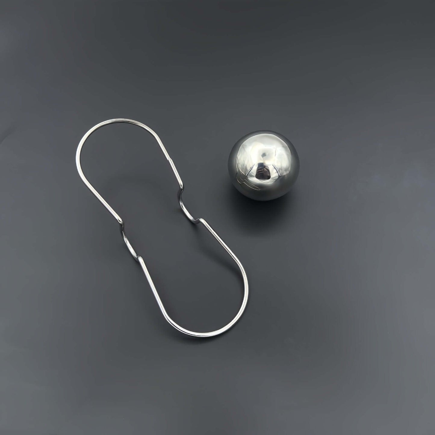 Espresso Chilling Ball and stainless steel holder for an ideal coffee cooling system.