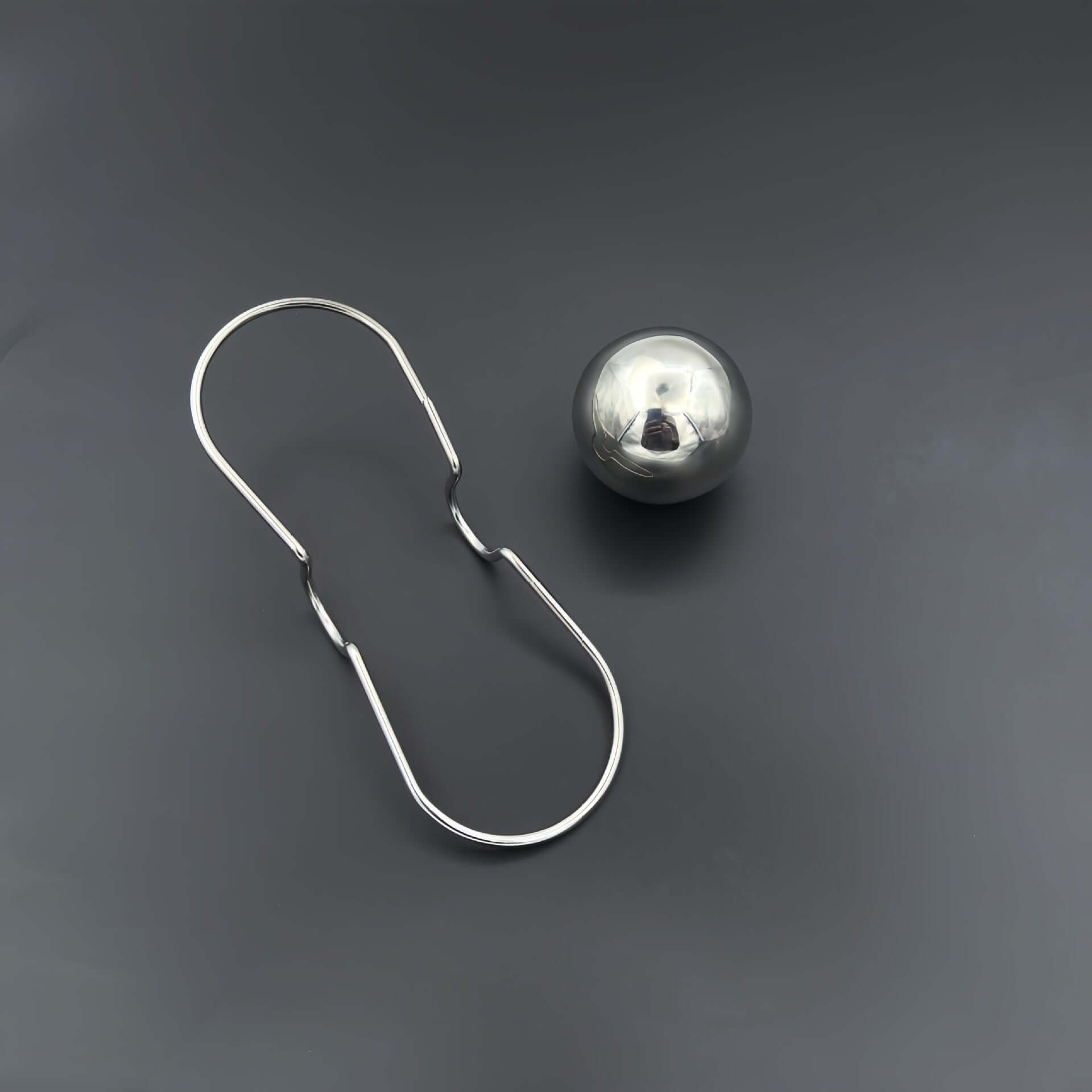 Espresso Chilling Ball and stainless steel holder for an ideal coffee cooling system.