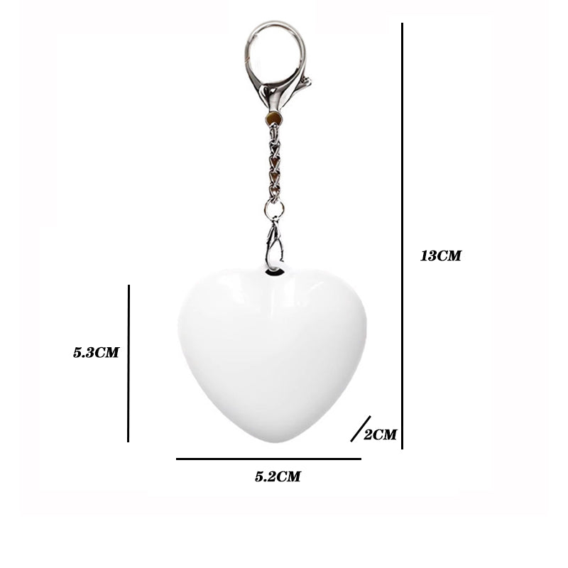 Heart Shaped Bag Light – The LUMI-HEART Glowing Handbag Charm dimensions showing a white heart keychain light.