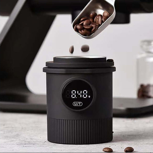 High Precision Coffee Scale showcasing a black powder cup with stainless steel inner liner and coffee beans being measured.
