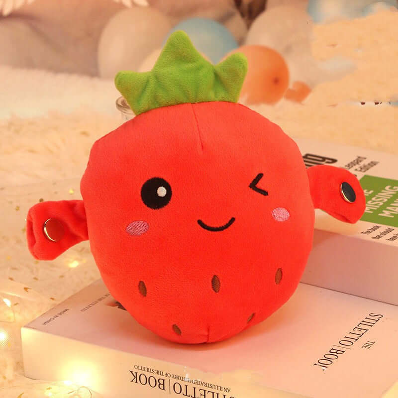 Human-Sensing Interactive Plush Toy - cute strawberry plush toy with smiling face and green leaves.