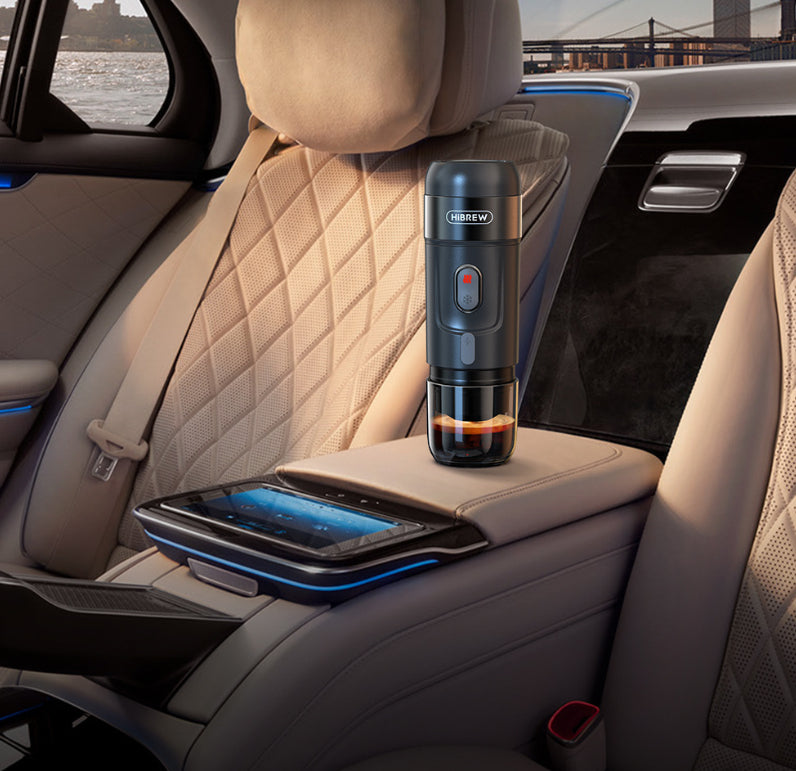 Portable Electric Espresso Maker on car armrest, showing convenience for coffee lovers on the go.