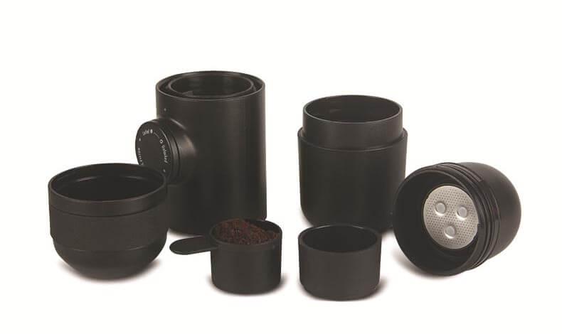 Portable Hand Espresso Maker accessories including black containers and measuring scoop for travel coffee brewing.