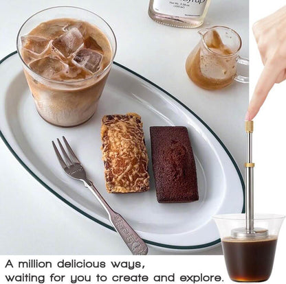A stainless steel Portable Press Coffee Infuser stick filtering coffee grounds inside a ceramic travel mug.