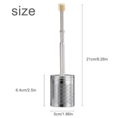 A stainless steel Portable Press Coffee Infuser stick filtering coffee grounds inside a ceramic travel mug.