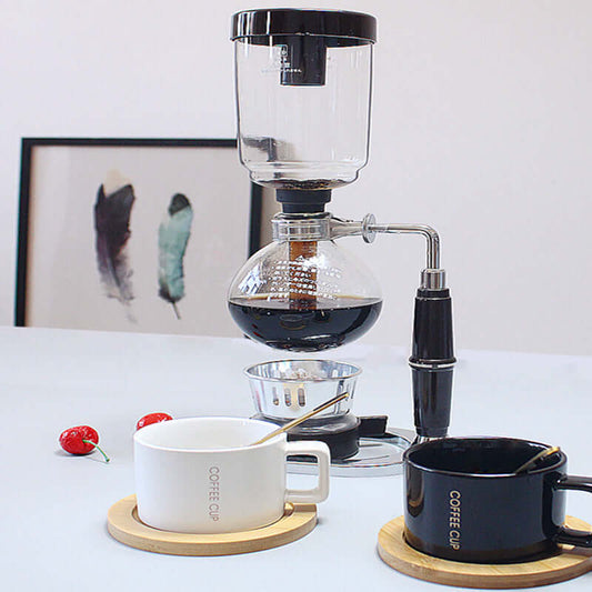 Premium Siphon Coffee Maker featured with coffee cups on a stylish countertop.