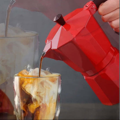 Stovetop Espresso Maker pouring coffee into a clear glass filled with ice and cream, showcasing a rich espresso blend.