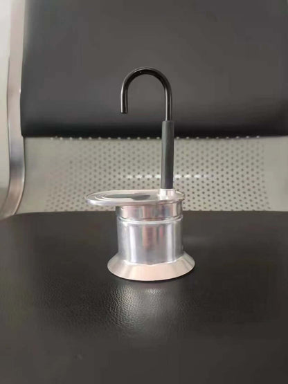 Single-Shot Aluminum Moka Pot with a classic octagonal design and heat-resistant handle on a minimalist kitchen counter.