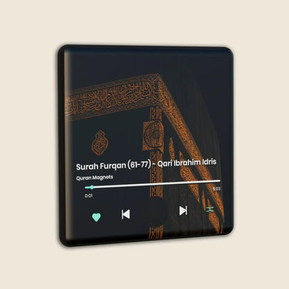 The Quran Magnet speaker SoulSound displays Surah Furqan (61-77) by Qari Ibrahim Idris with playback controls over an image of the Kaaba’s corner, featuring gold Quranic calligraphy on black cloth.