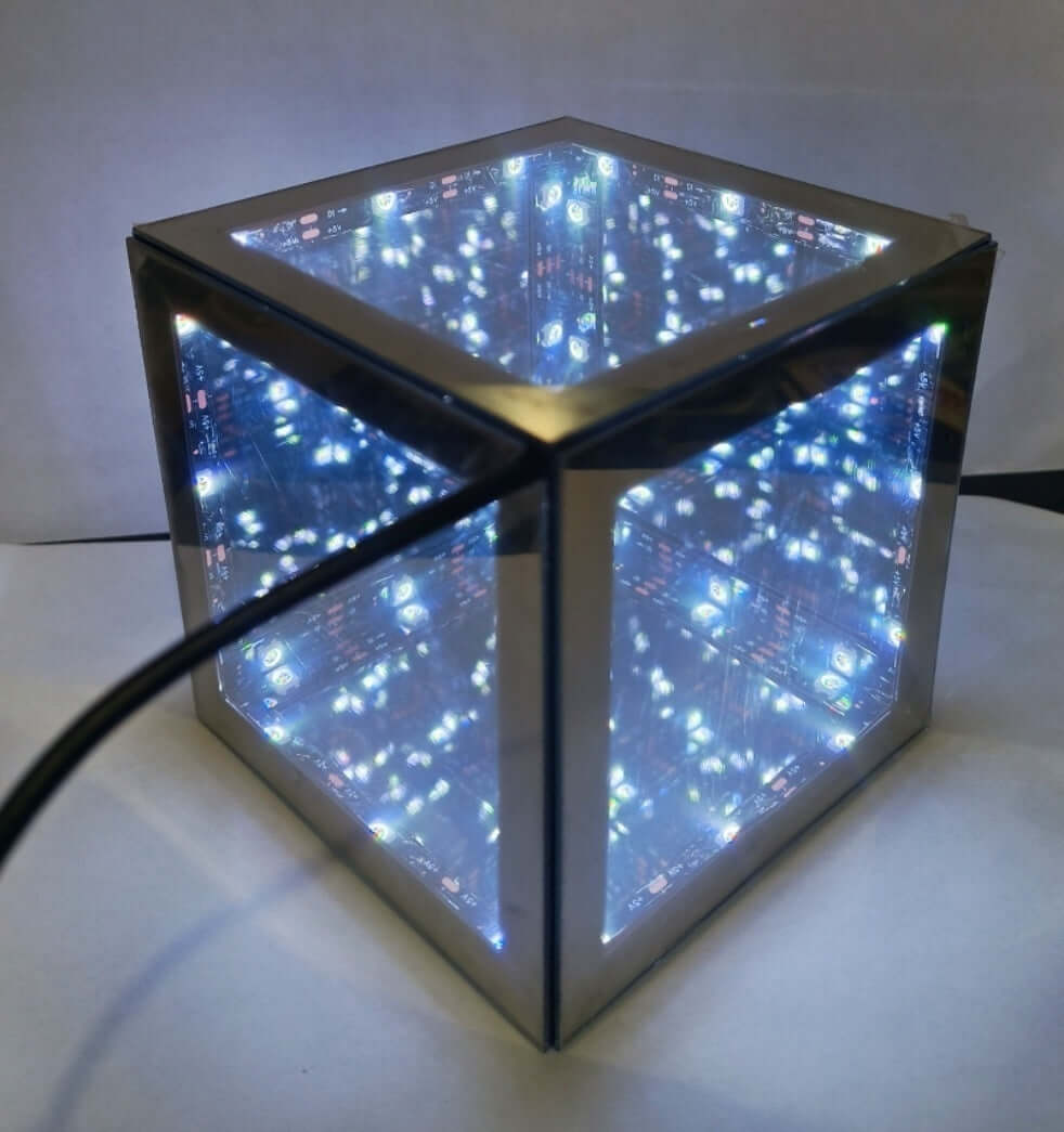 Tesseract Abyss Lamp showcasing an infinity mirror hypercube with geometric light loops.