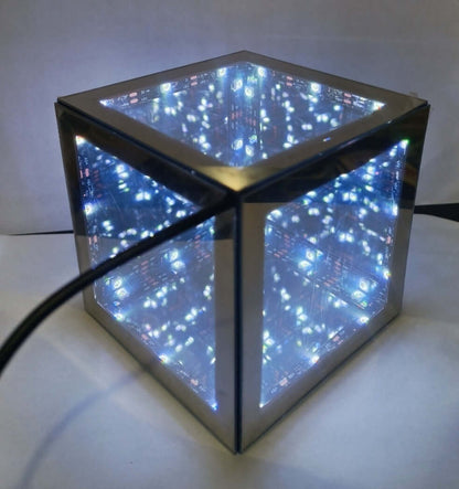 Tesseract Abyss Lamp showcasing an infinity mirror hypercube with geometric light loops.