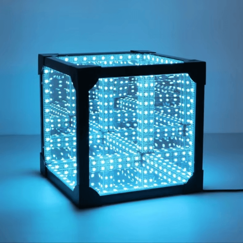 Tesseract Abyss Lamp - Infinity Mirror Hypercube Desktop Light projecting geometric light loops in blue.