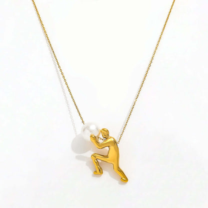 The Ambition Pearl Necklace featuring a gold figure supporting a pearl, symbolizing strength and persistence.