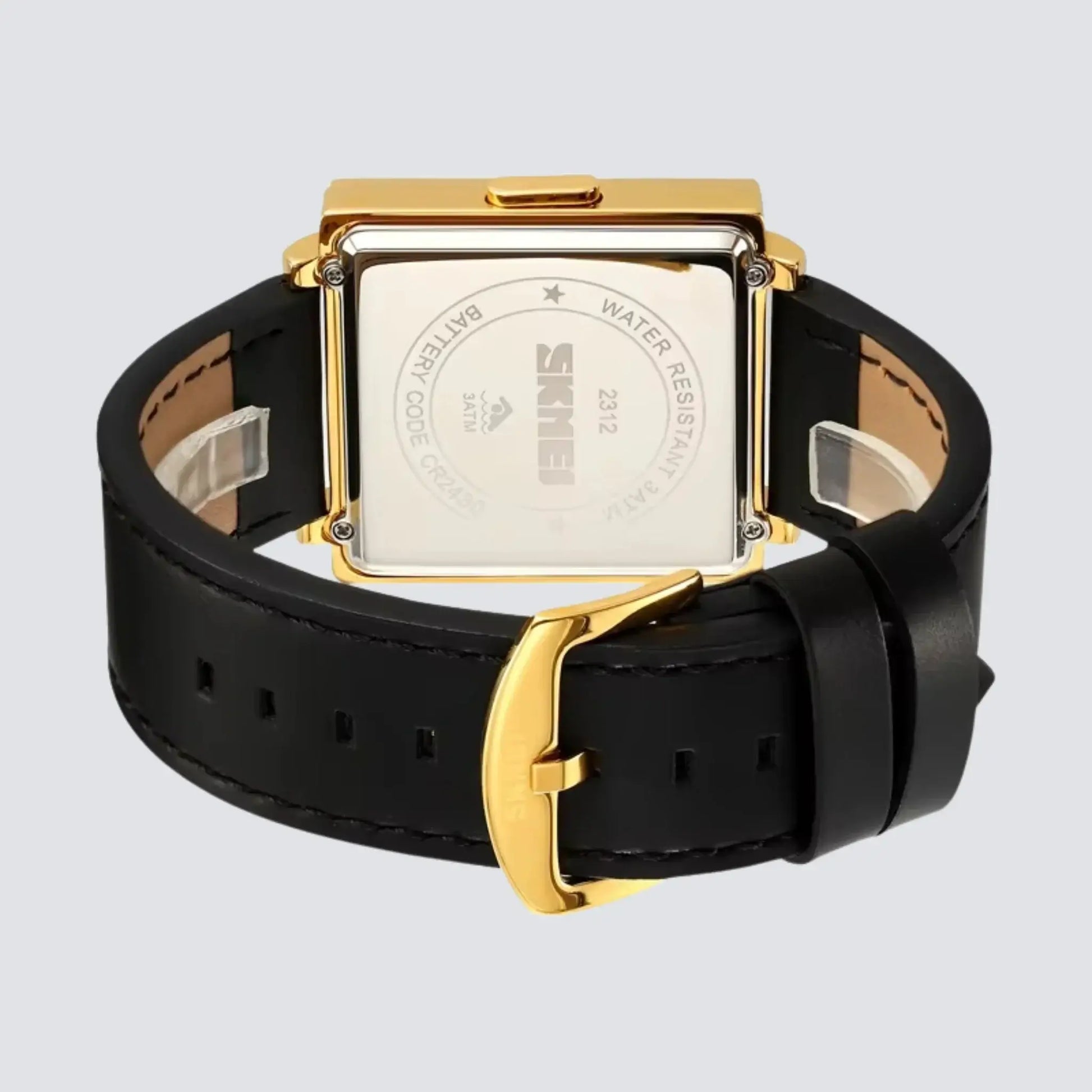 Back view of a retro digital watch with a gold case and black leather strap, showcasing its sleek design.