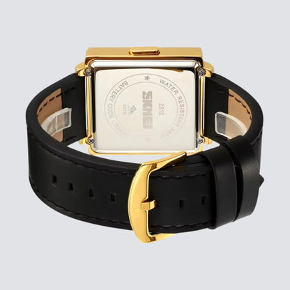 Back view of a retro digital watch with a gold case and black leather strap, showcasing its sleek design.
