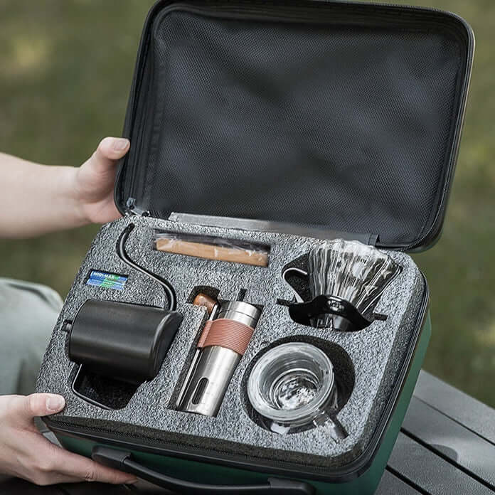 Travel coffee maker set displayed in a compact portable case, ideal for brewing on the go.