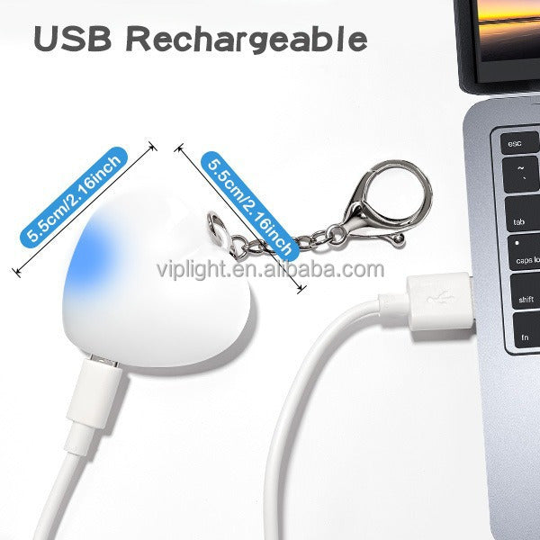 Heart Shaped Bag Light – The LUMI-HEART Glowing Handbag Charm USB rechargeable with keychain attached.