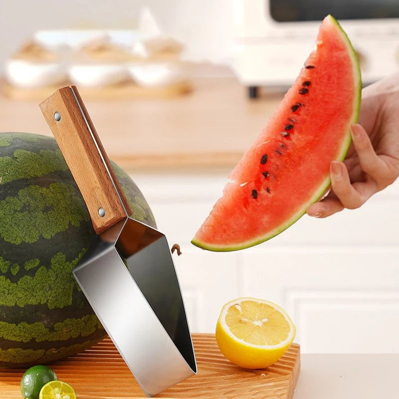 Watermelon Splitter being used to slice watermelon with wooden handle and fresh fruit in the background